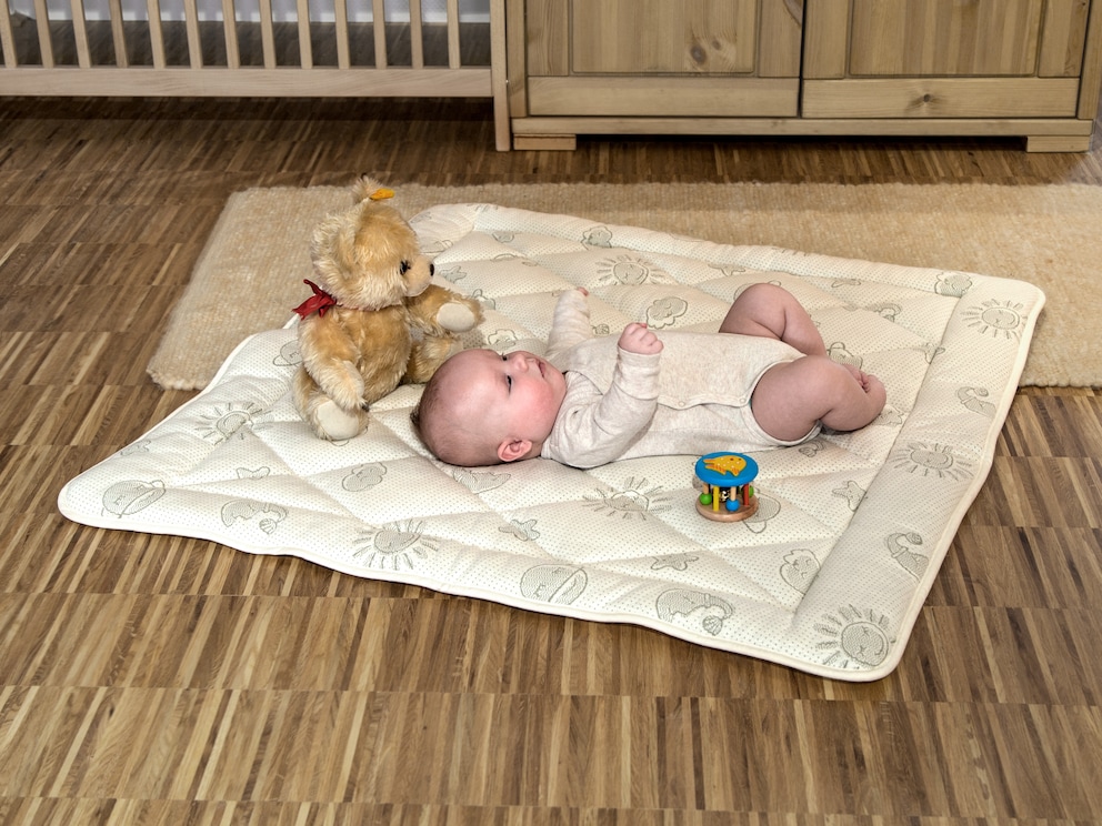 « Cotona » offre une protection à votre bébé lors des moments ludiques au sol et invite à des instants câlins