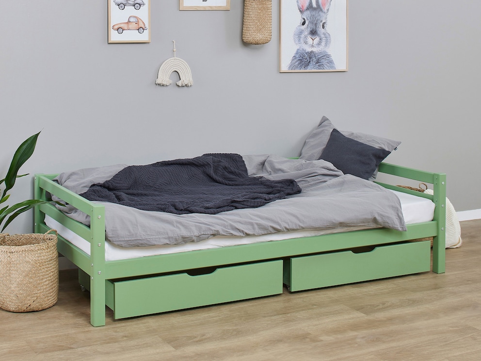 De optionele lades hebben altijd dezelfde kleur als het bedframe, hier beide in groen