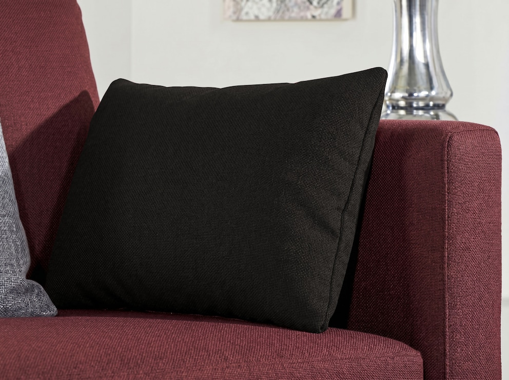Le coussin d'accoudoir Monara – ici avec la housse Opera, couleur anthracite