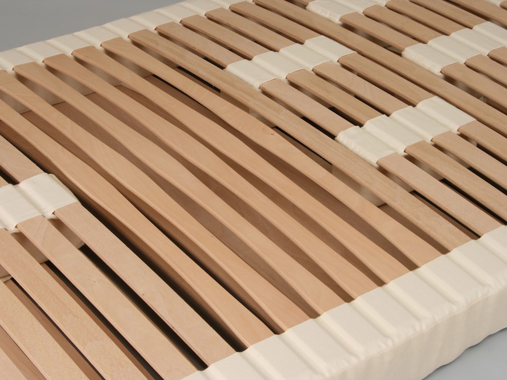 Structures latérales de support et blocs rembourrés coulissants avec poches en tissu pour le guidage des lattes