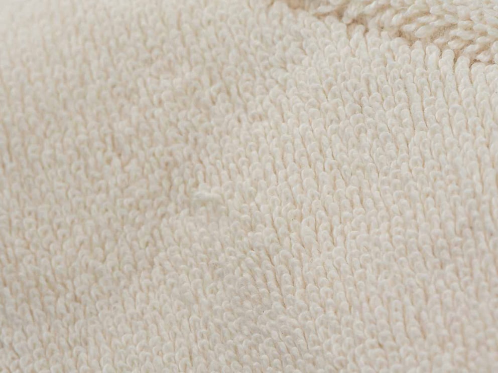 Gestructureerd badstof weefsel voor een aangenaam micromassage-effect