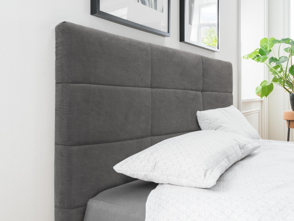 Volumineus gestoffeerd hoofdbord met cassette-quilting voor een indrukwekkende look