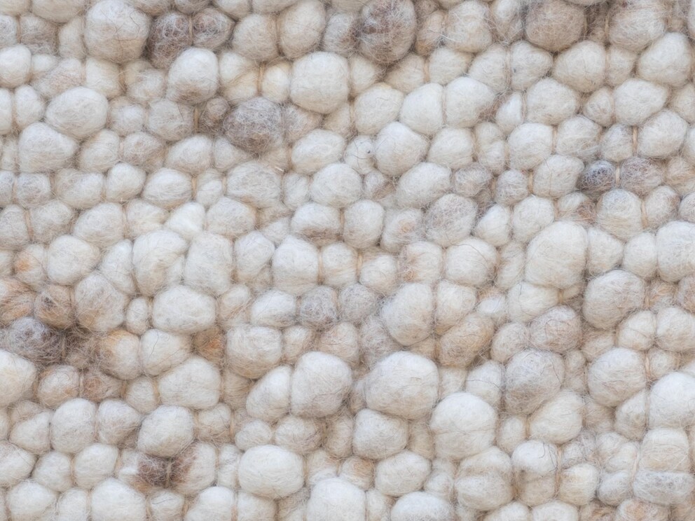 Couleur sable, chiné dans des tons de brun doux