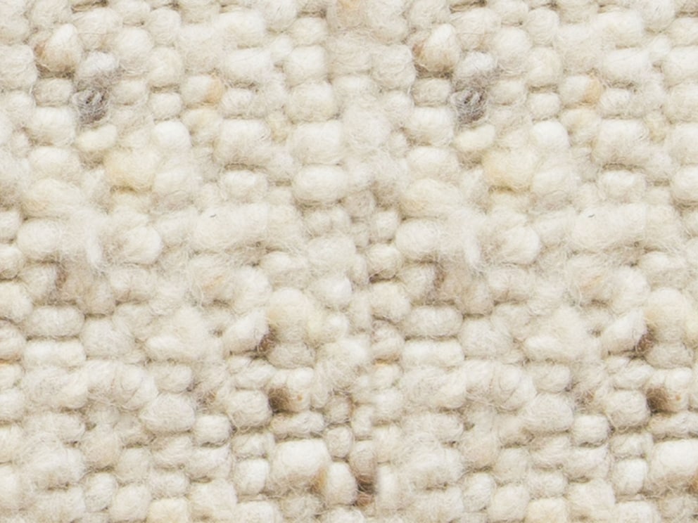 Die Matte in beige mit dezenten Melierungen wirkt hell und freundlich
