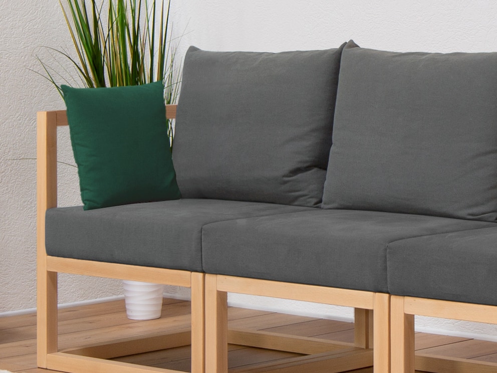 Coussin de canapé vert foncé comme complément pratique à nos canapés